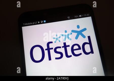 The Office for Standards in Education, Children`s Services and Skills (Ofsted) logo on smartphone Stock Photo